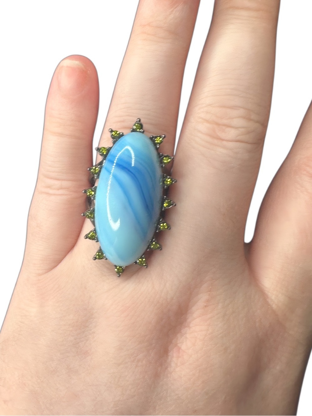 Blue Oval Stone Ring with Green Accent Stones